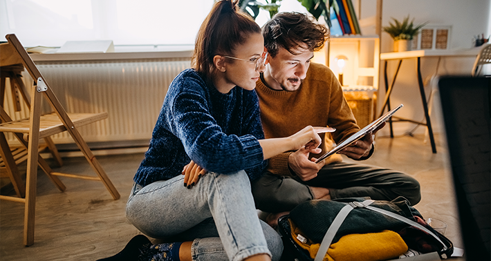 Man and Woman looking at Tablet